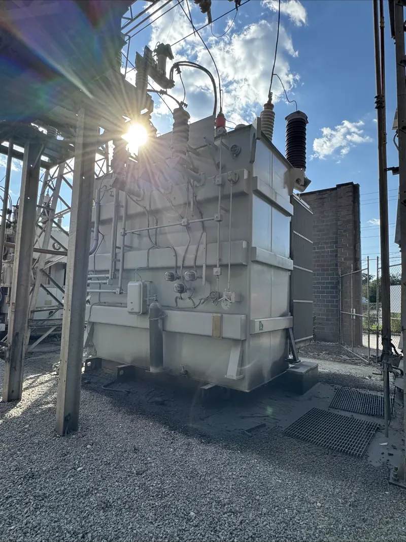 An outdoor substation on a gravel yard