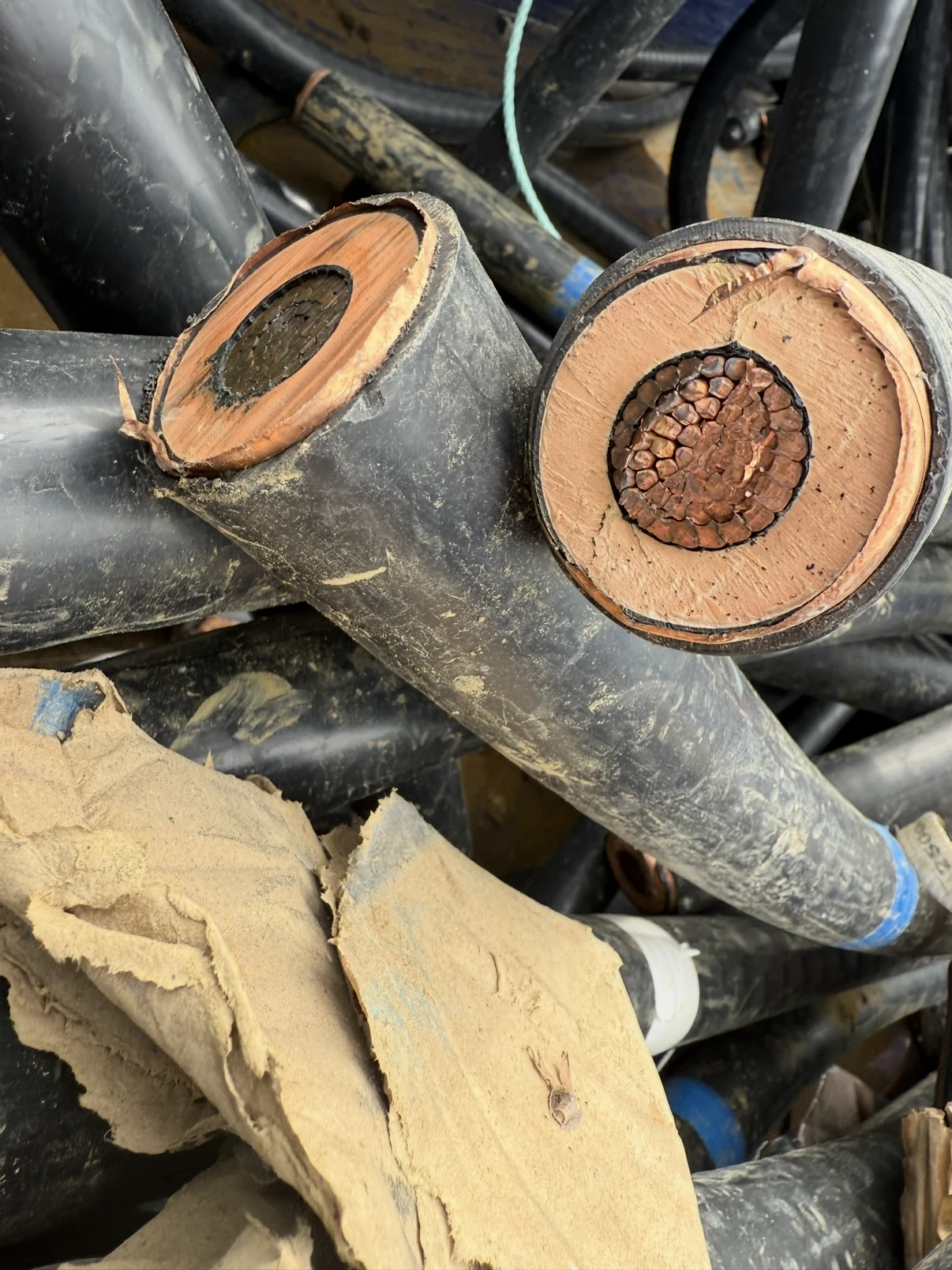 Cut ends of heavy insulated copper electrical cable.