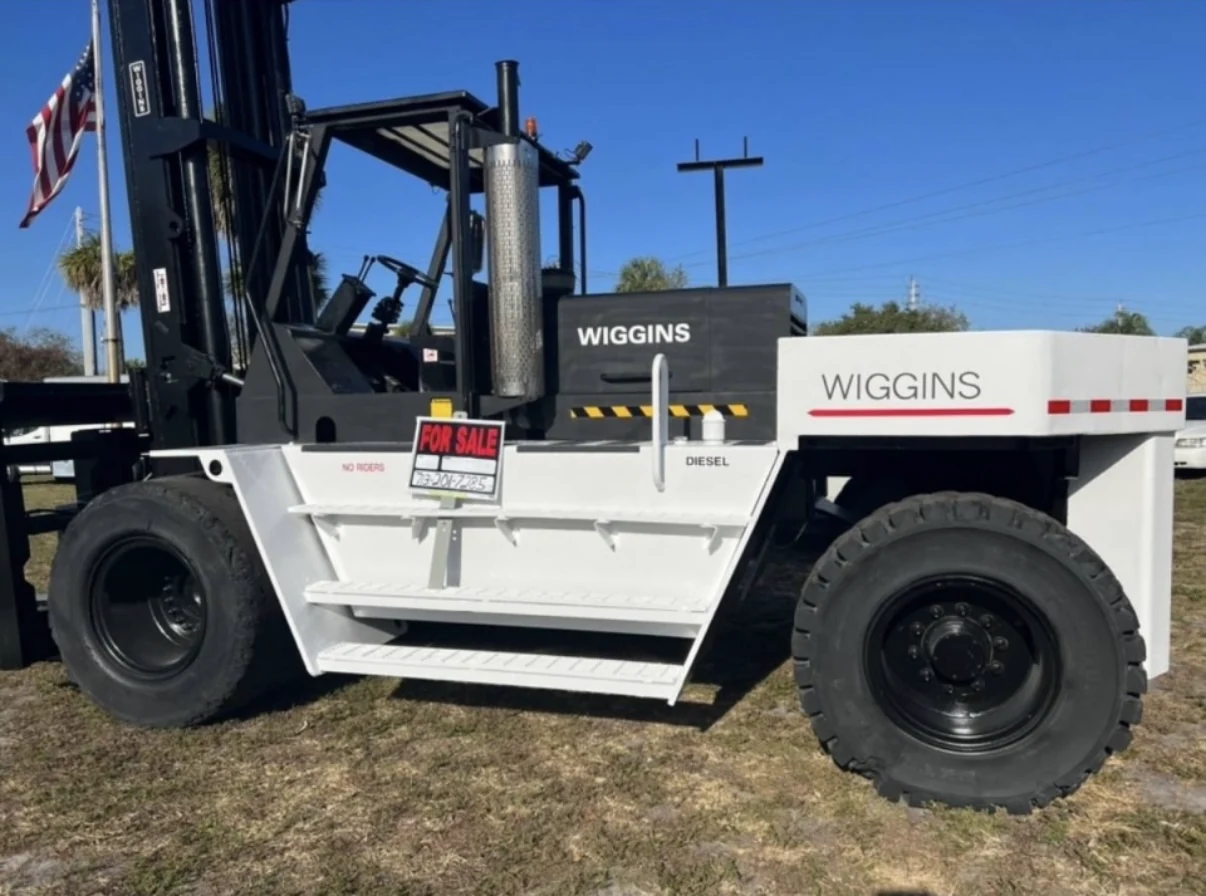White Wiggins diesel forklift parked outdoors.